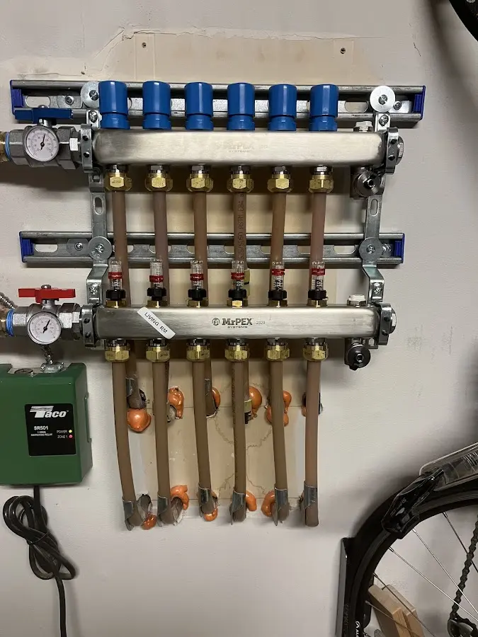 Plumber performing Water Heater Repair at a residential property in Blanding